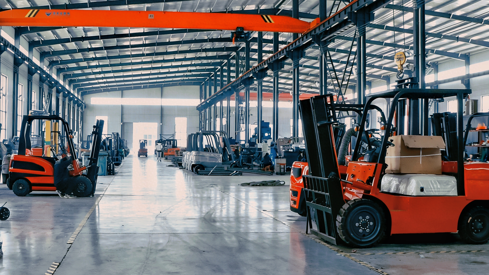 Quality control inspection of electric forklift components, workers in blue uniforms examining parts under bright industrial lighting
